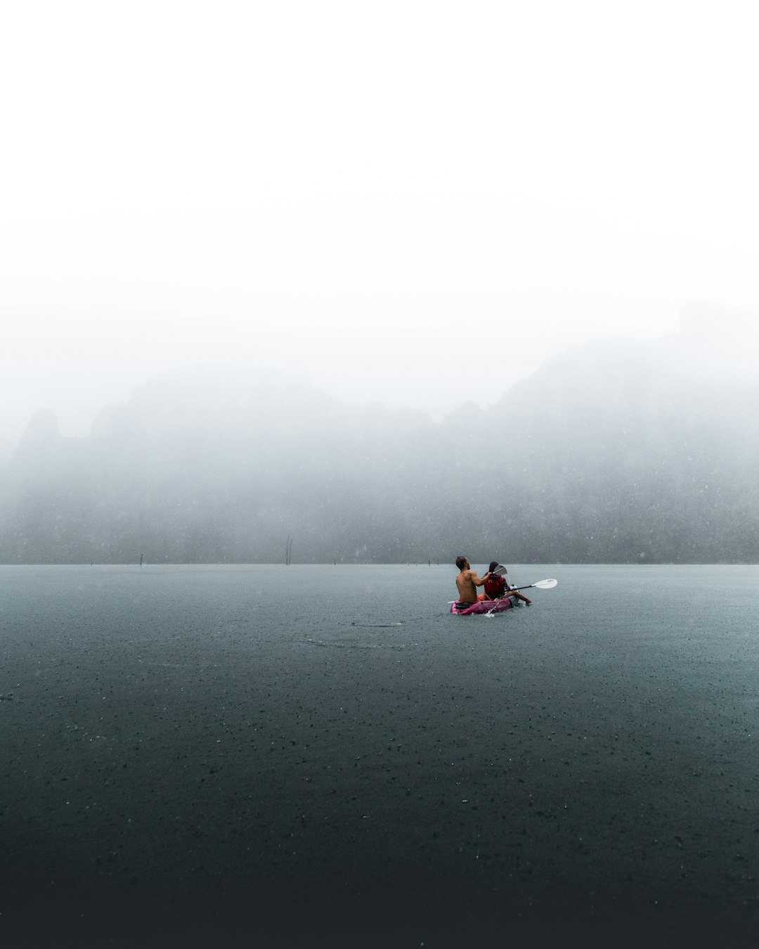 person in boat on body of water