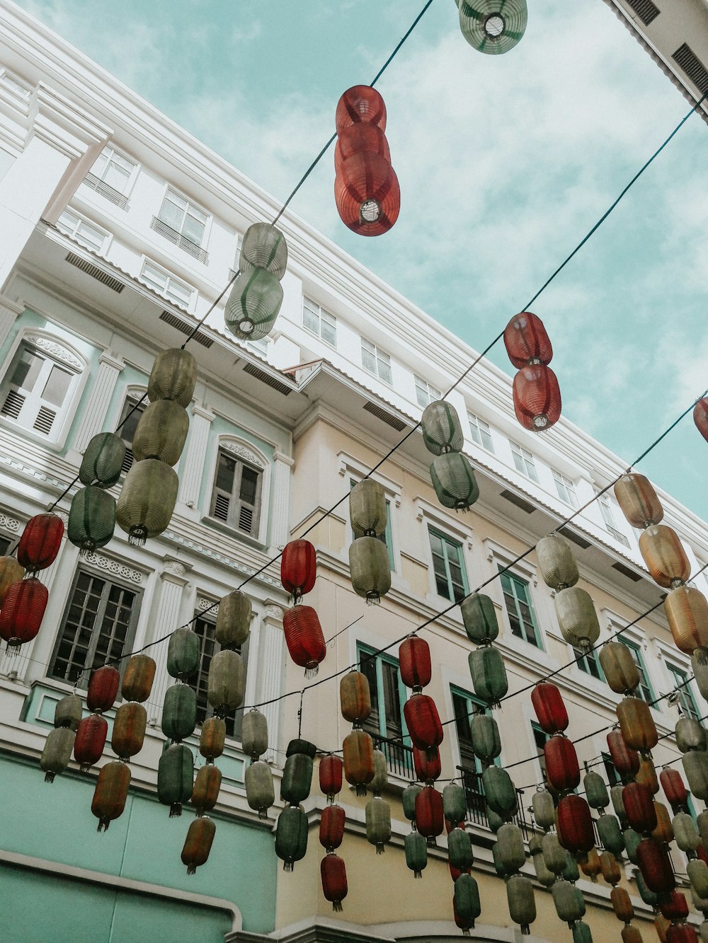 hanging lanterns on wire at daytime