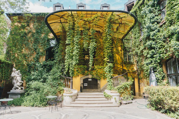 A charming European winery facade with flowering vines climbing the walls