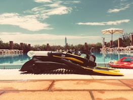 A friendly local guide handing snorkel gear to excited travelers before a day trip.