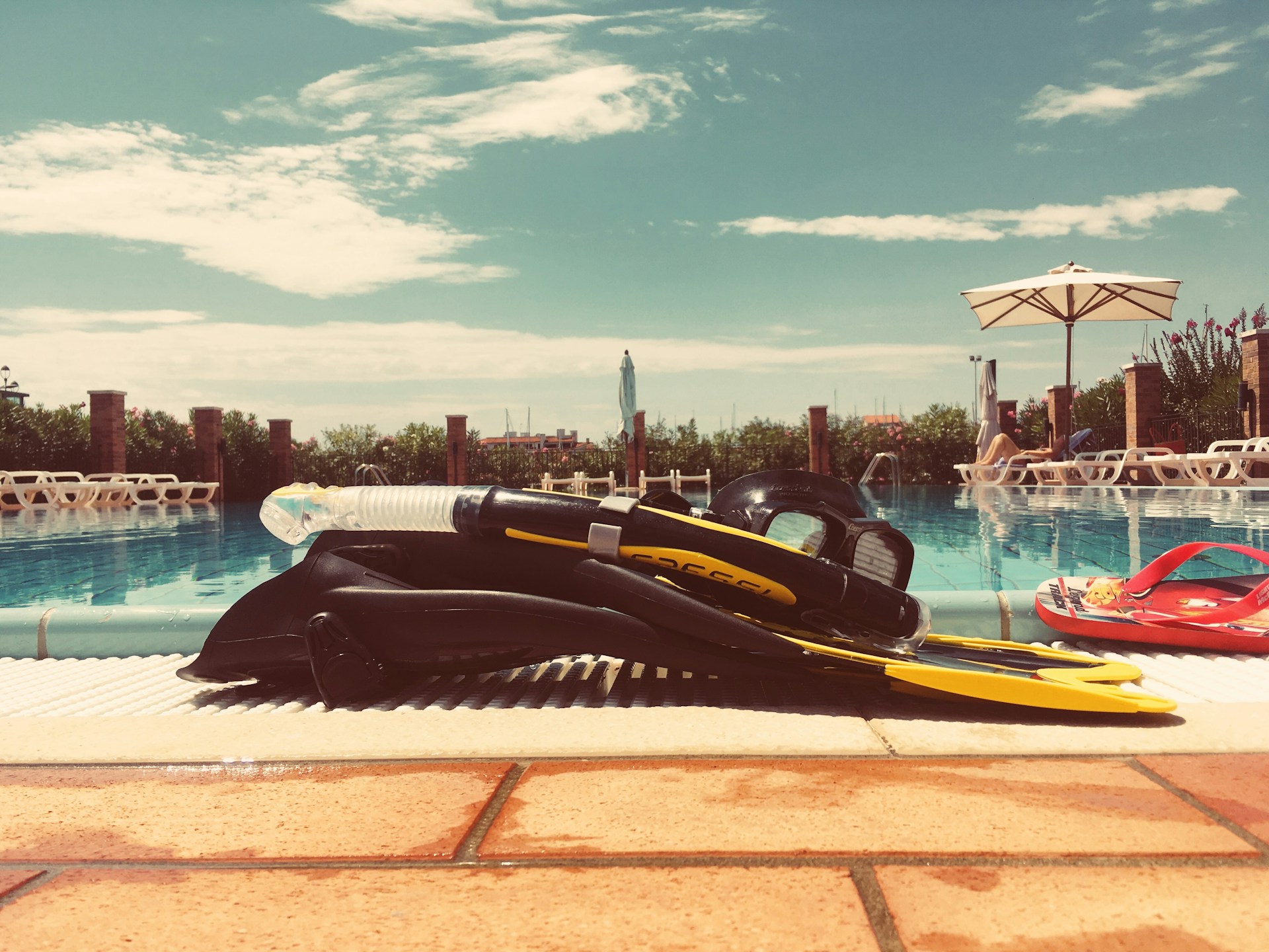 woman wearing yellow long-sleeved dress under white clouds and blue sky during daytime