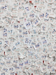 Close-up of security badges and official permits displayed on a desk.