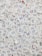 A large collection of visitor badges with handwritten numbers scattered chaotically. The numbers are mainly in blue ink, and the badges are made of paper with both English and Chinese text printed in red and blue. The background is mostly paper, displaying a dense and overlapping pattern due to the number of badges.