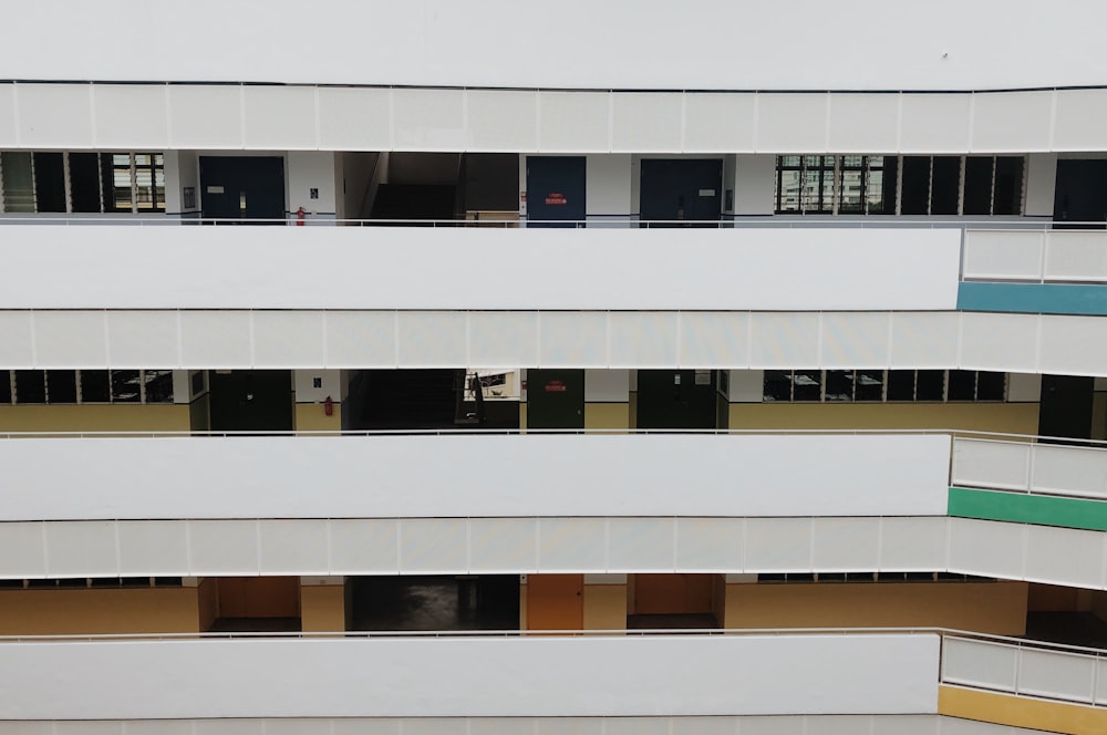 white and blue 3-storey building