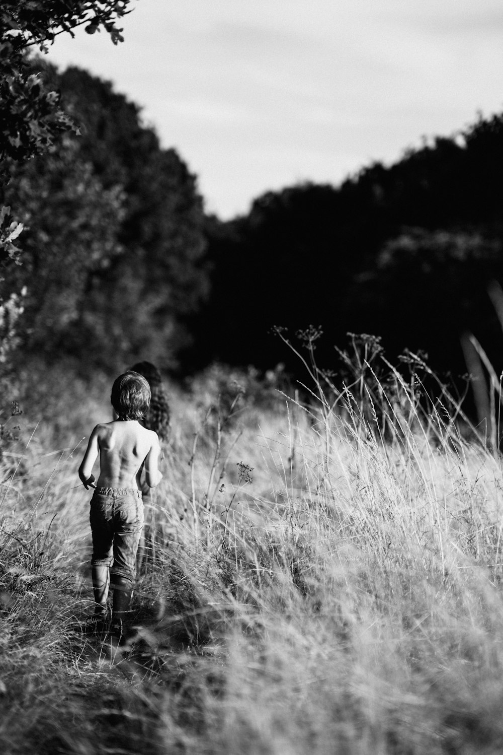 boy walking on grass