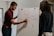 man drawing on dry-erase board