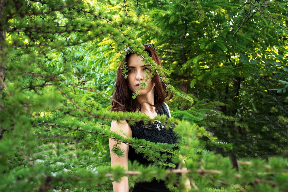 woman beside green tree