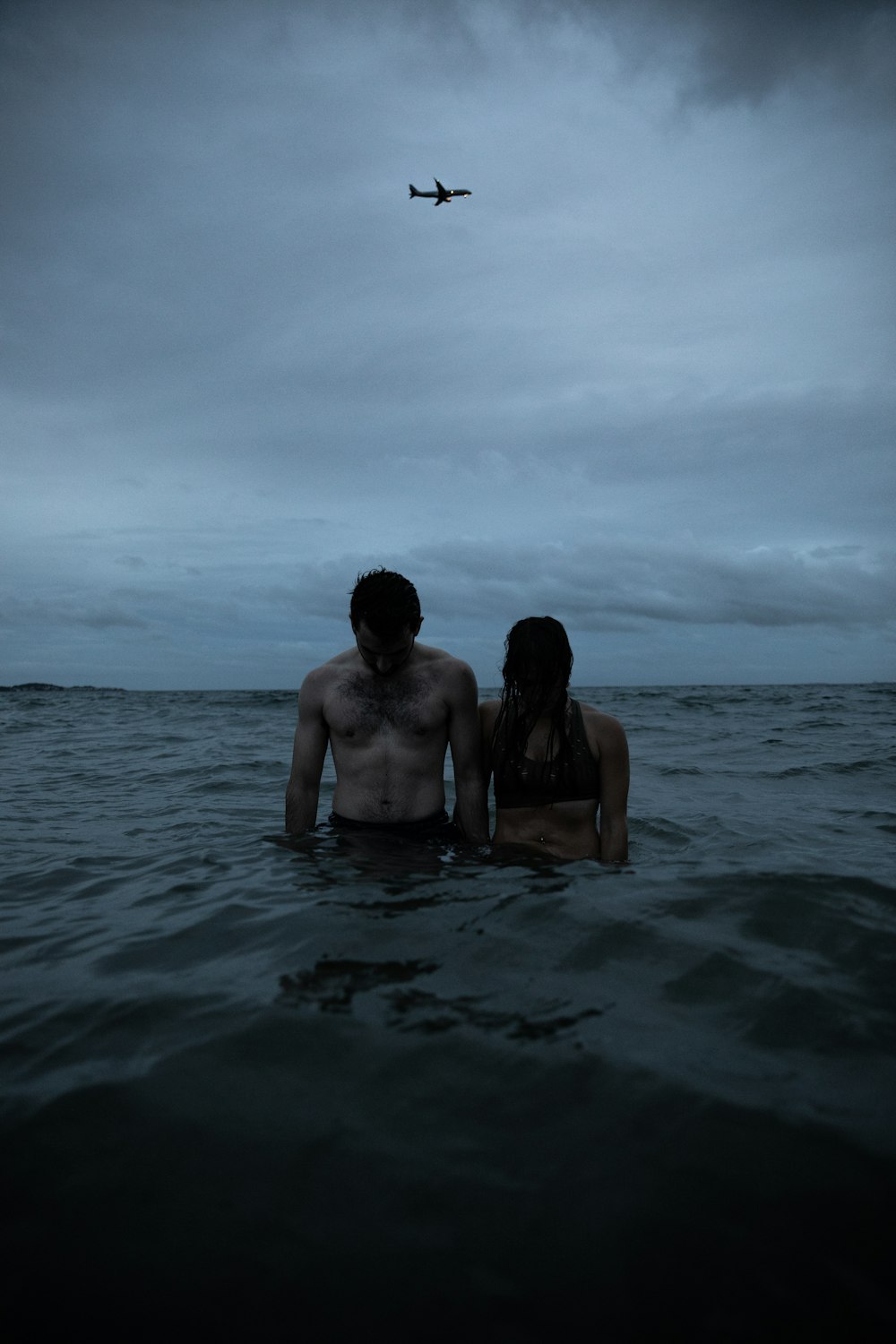 photo of couple on body of water