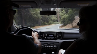man driving car