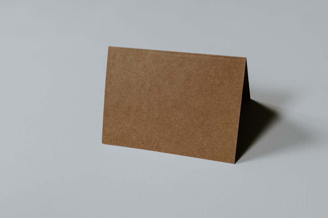 brown hardbound book on white surface, Blank Brown Card