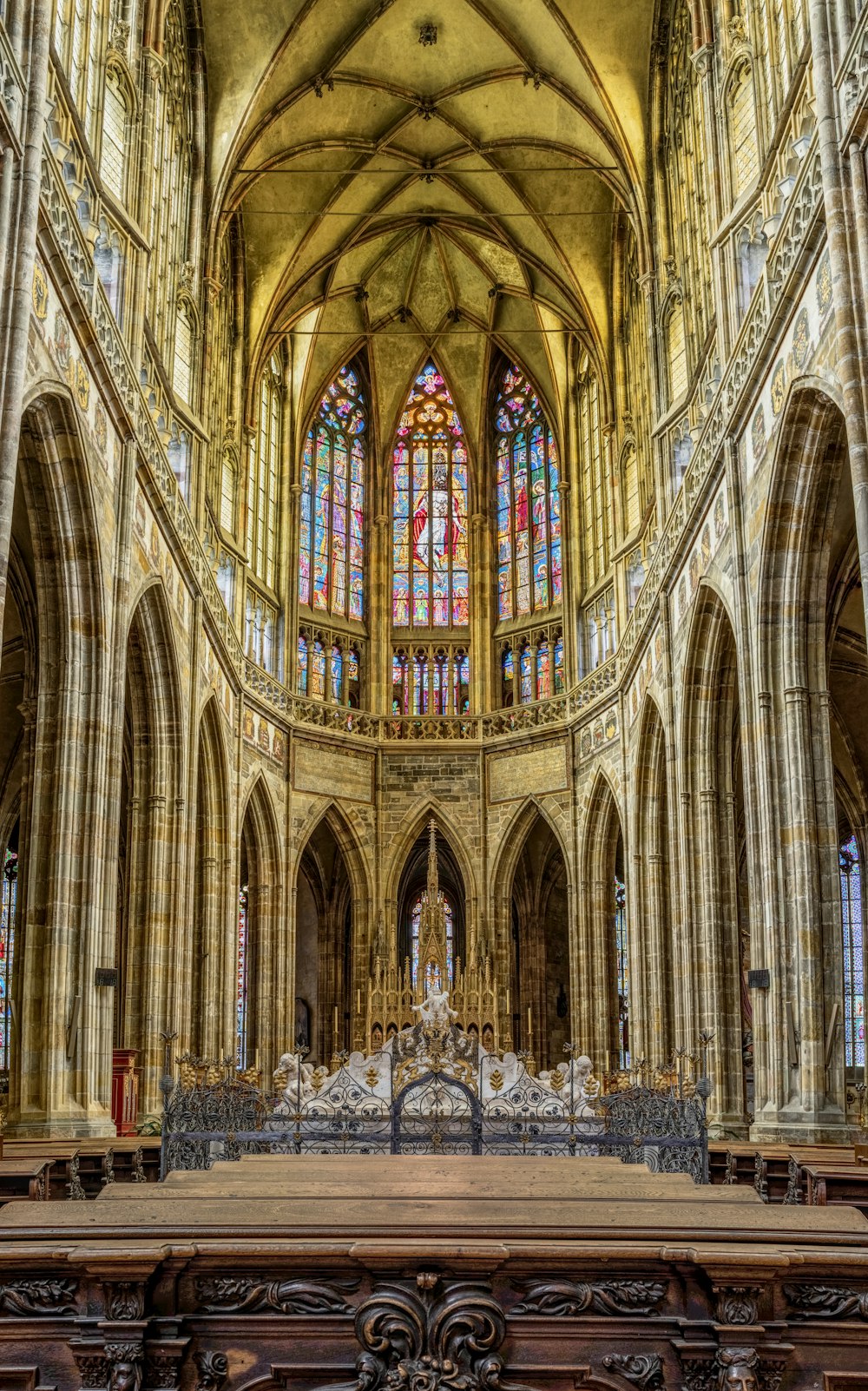 group of people inside gray concrete cathedral interior