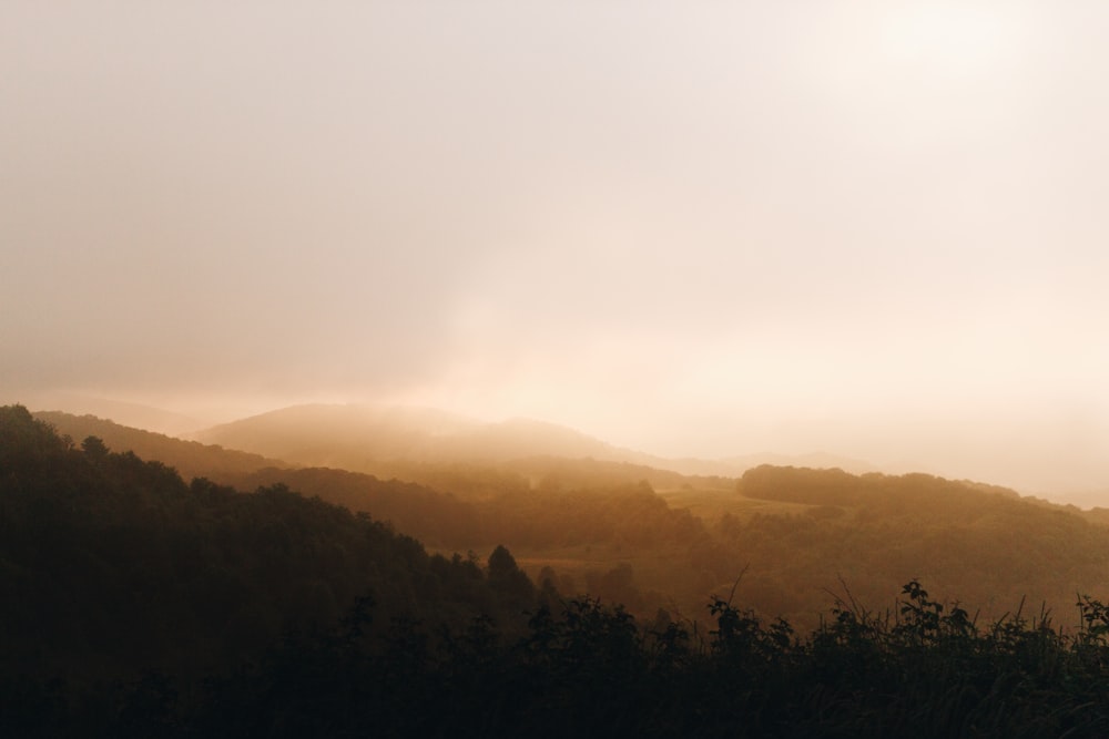 silhouette photo of mountain at sunset