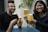 A group of happy people enjoying drinks at a gathering.