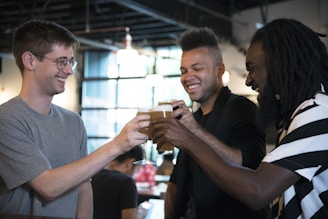 A happy entrepreneur celebrating a successful brand launch with friends in a cozy café.