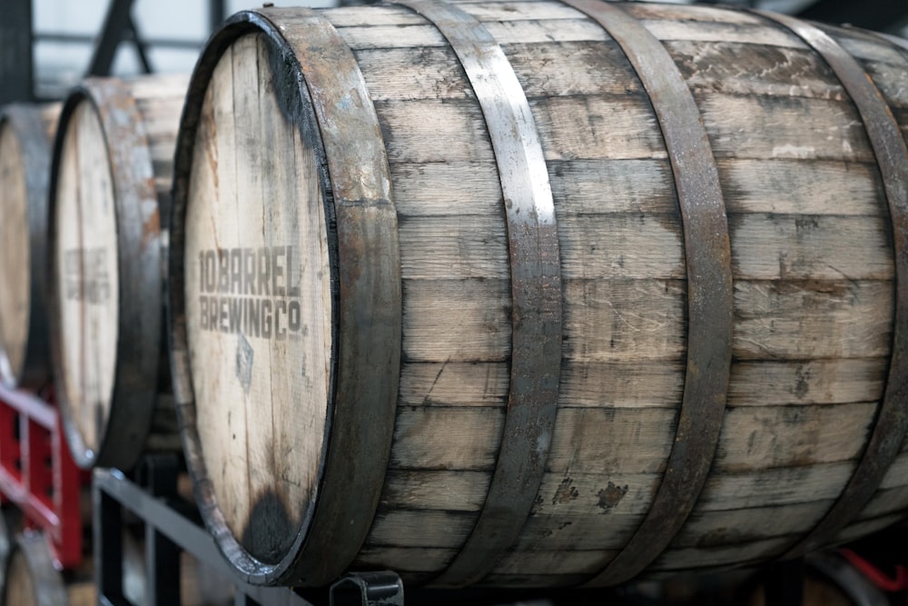 beige wooden barrel on black crate