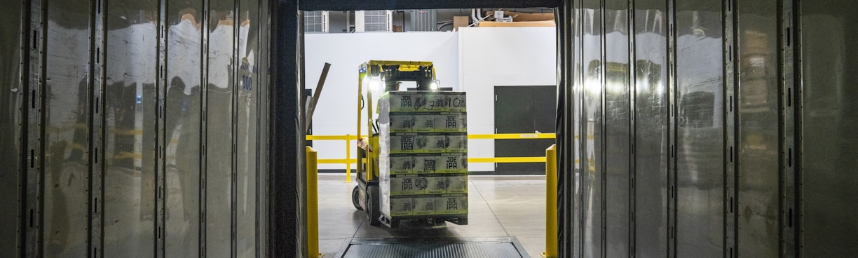 yellow and black forklift during daytime