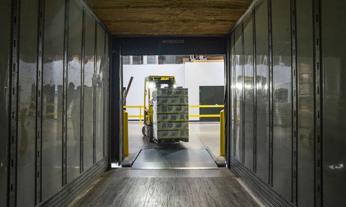 yellow and black forklift during daytime