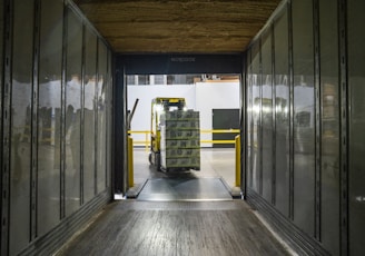 yellow and black forklift during daytime