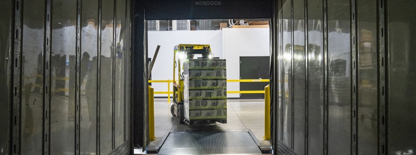 yellow and black forklift during daytime