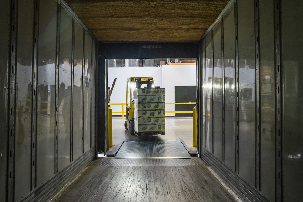 yellow and black forklift during daytime