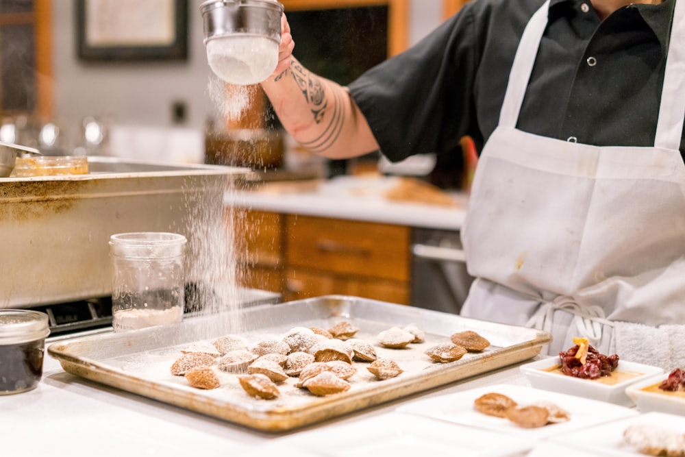 person baking infront of table