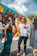 A group enjoying a wine tasting session while painting colorful murals.