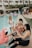 A group of friends relaxing by a wave pool.