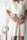 woman in white elbow-sleeved shirt standing with man