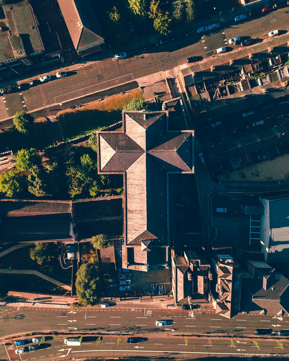 top view of city buildings and cars on road during daytime