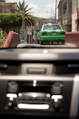 A taxi driving along a scenic coastal road in Fuerteventura.