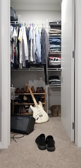 white electric guitar in closet