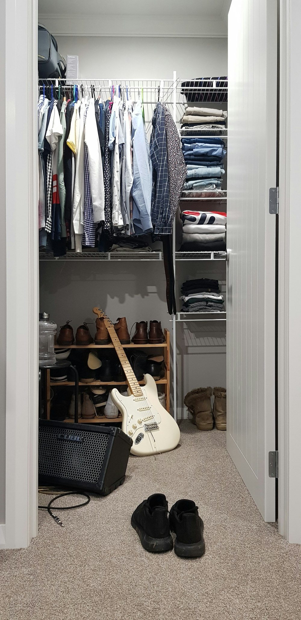 white electric guitar in closet