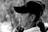 grayscale photography of man wearing black cap