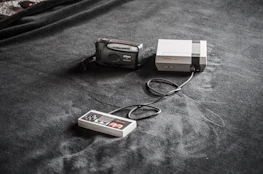 A happy customer unboxing a rare vintage gaming console.