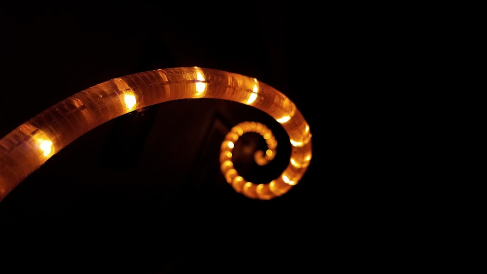 selective focus photography of brown spiraled LED light