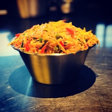 A vibrant bowl filled with colorful vegetables and grains.