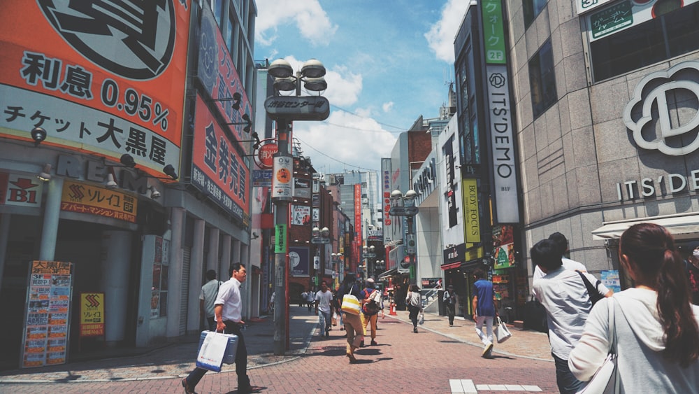 group of people walking on street