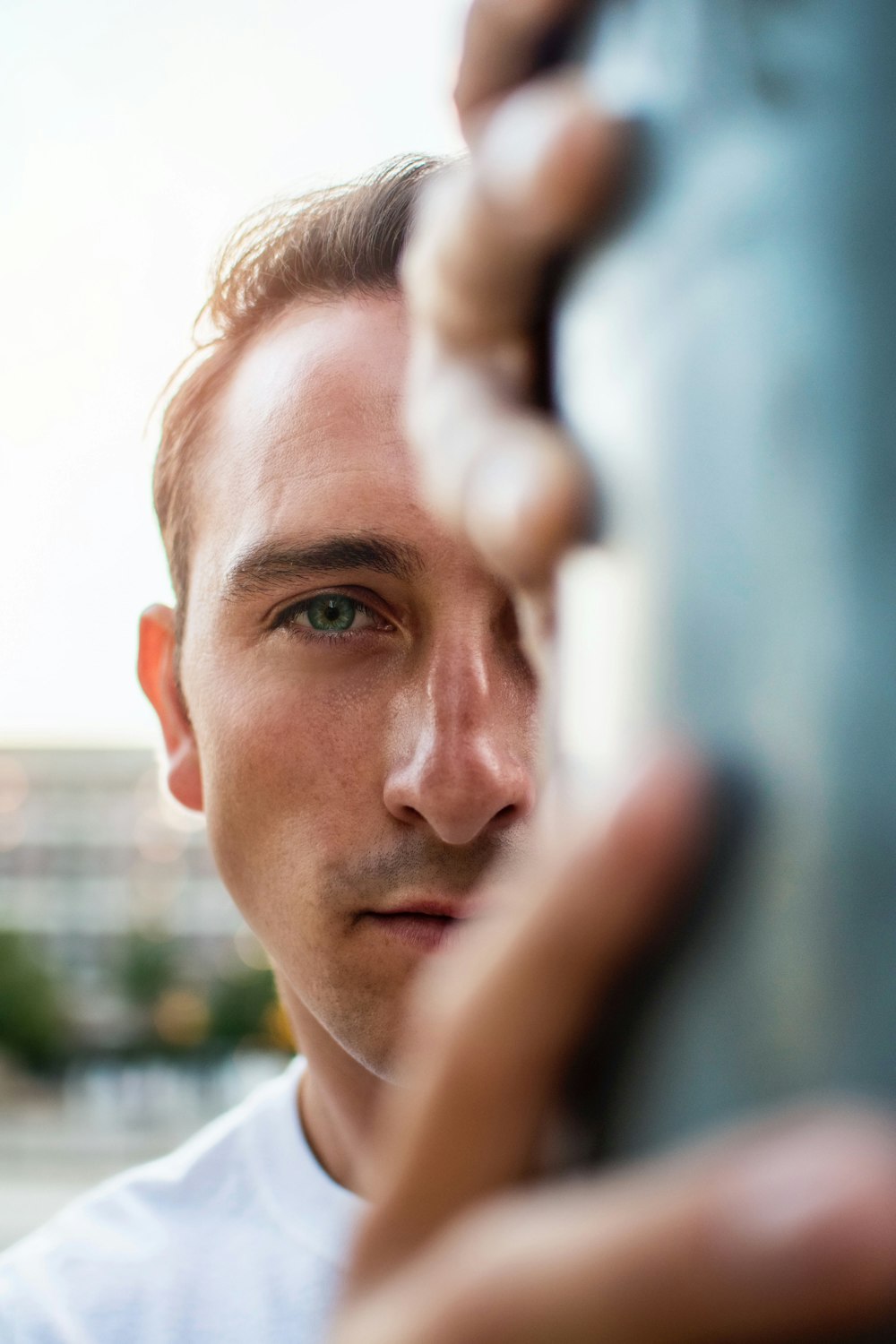 a close up of a person holding a metal object