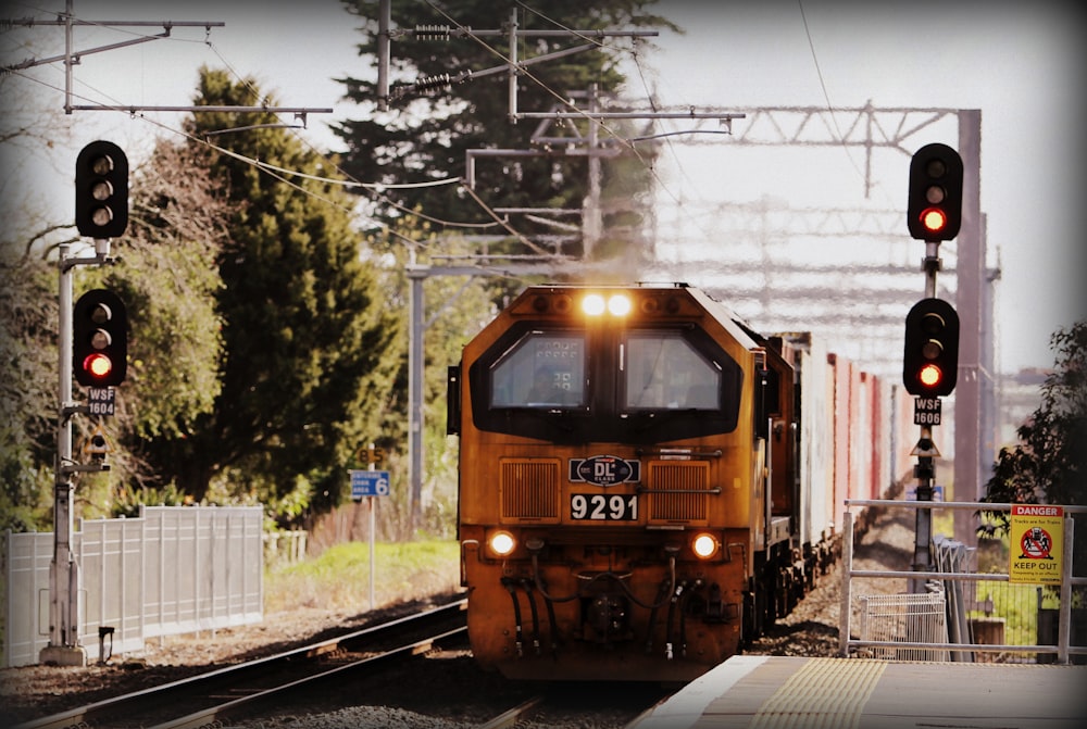 yellow train near platform