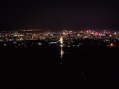 A vibrant cityscape of Panama City at night.