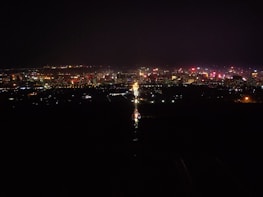A vibrant cityscape of Panama City at night.