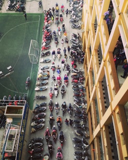 bird's-eye view photo of row of motorcycles on road