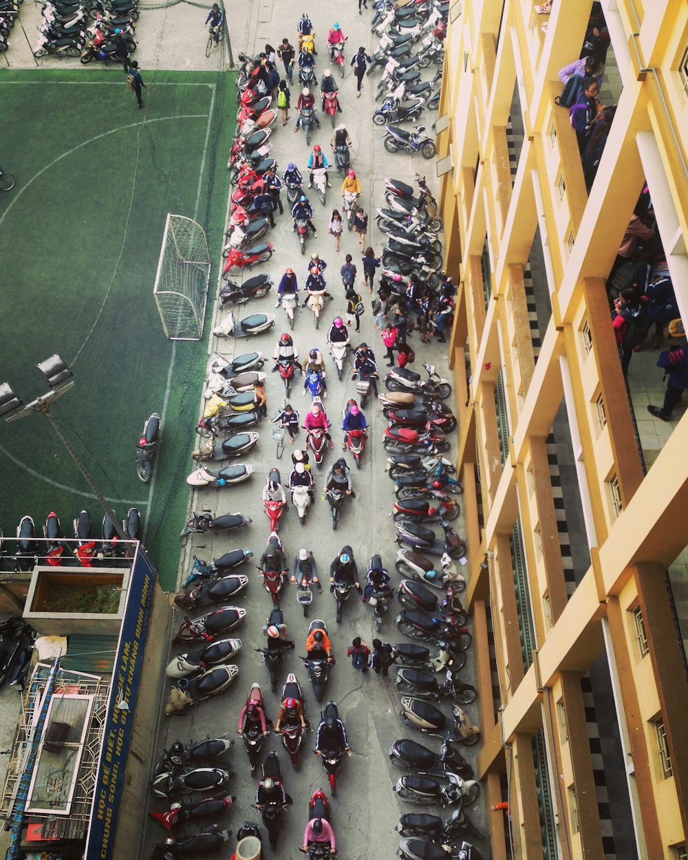 bird's-eye view photo of row of motorcycles on road