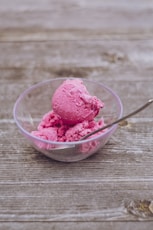 strawberry ice cream in clear glass bowl