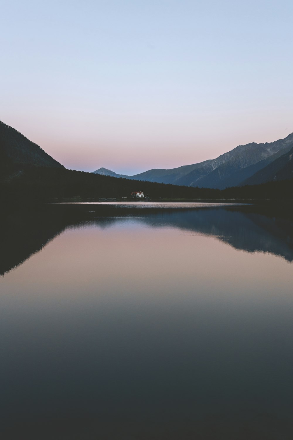 body of water in front of mountain