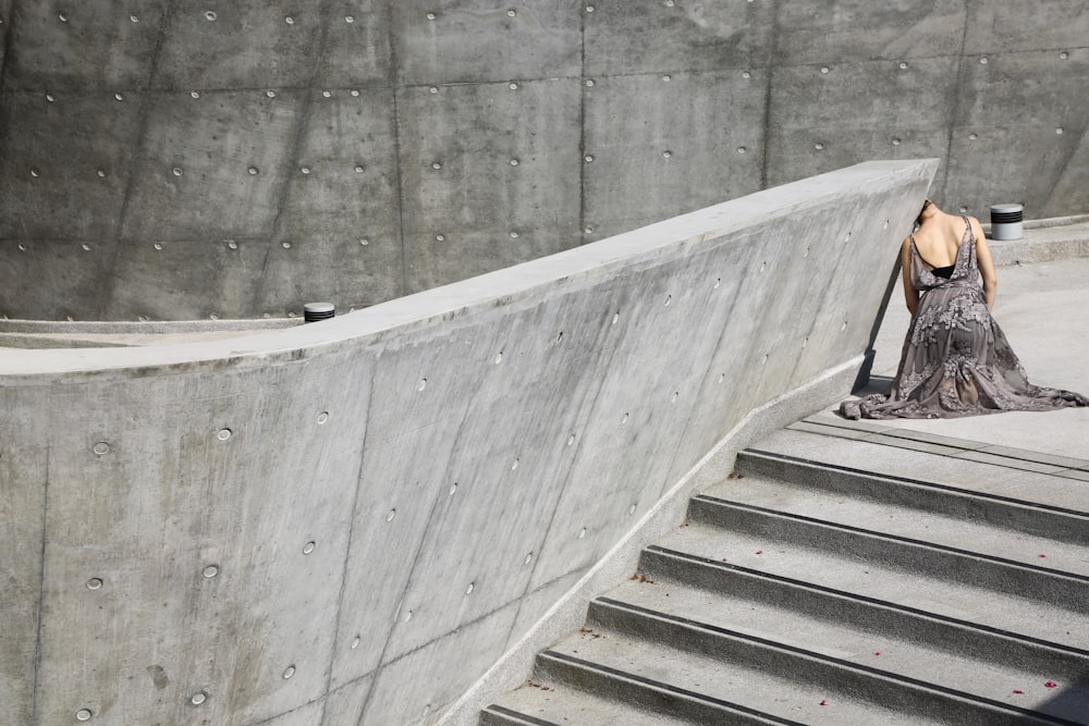 woman leaning on wall