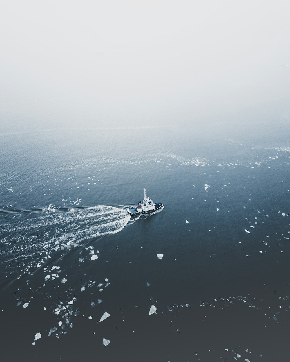 black coat on body of water