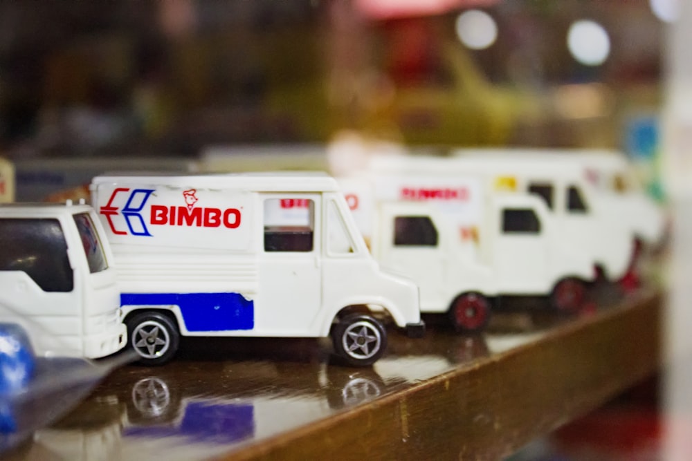 selective focus photography of white Bimbo truck die-cast model