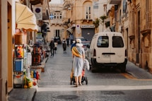 woman standing near white vehicle