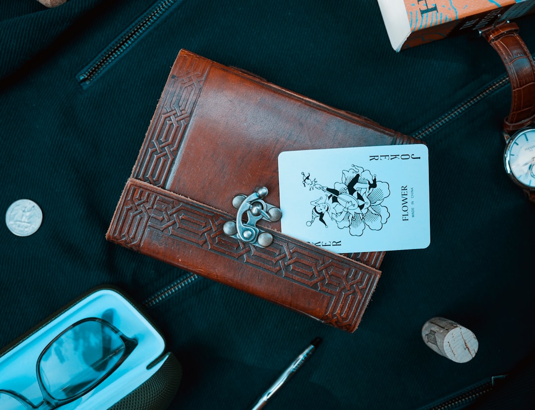 Joker card on brown leather wallet
